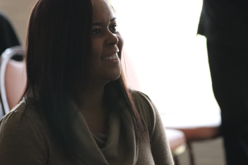 Annette smiling during a conversation